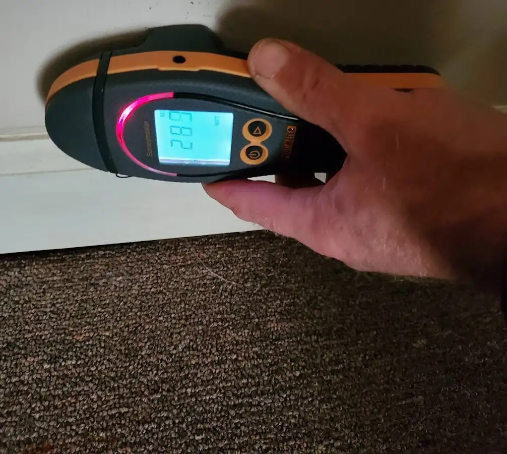 Moisture detection at baseboard during Storm Damage Restoration in Bellevue